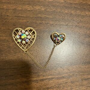 Vintage gold tone AB coated rhinestone two heart brooch.